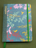 Handmade creative Journal with floral pattern and 'imagine' text on a green background